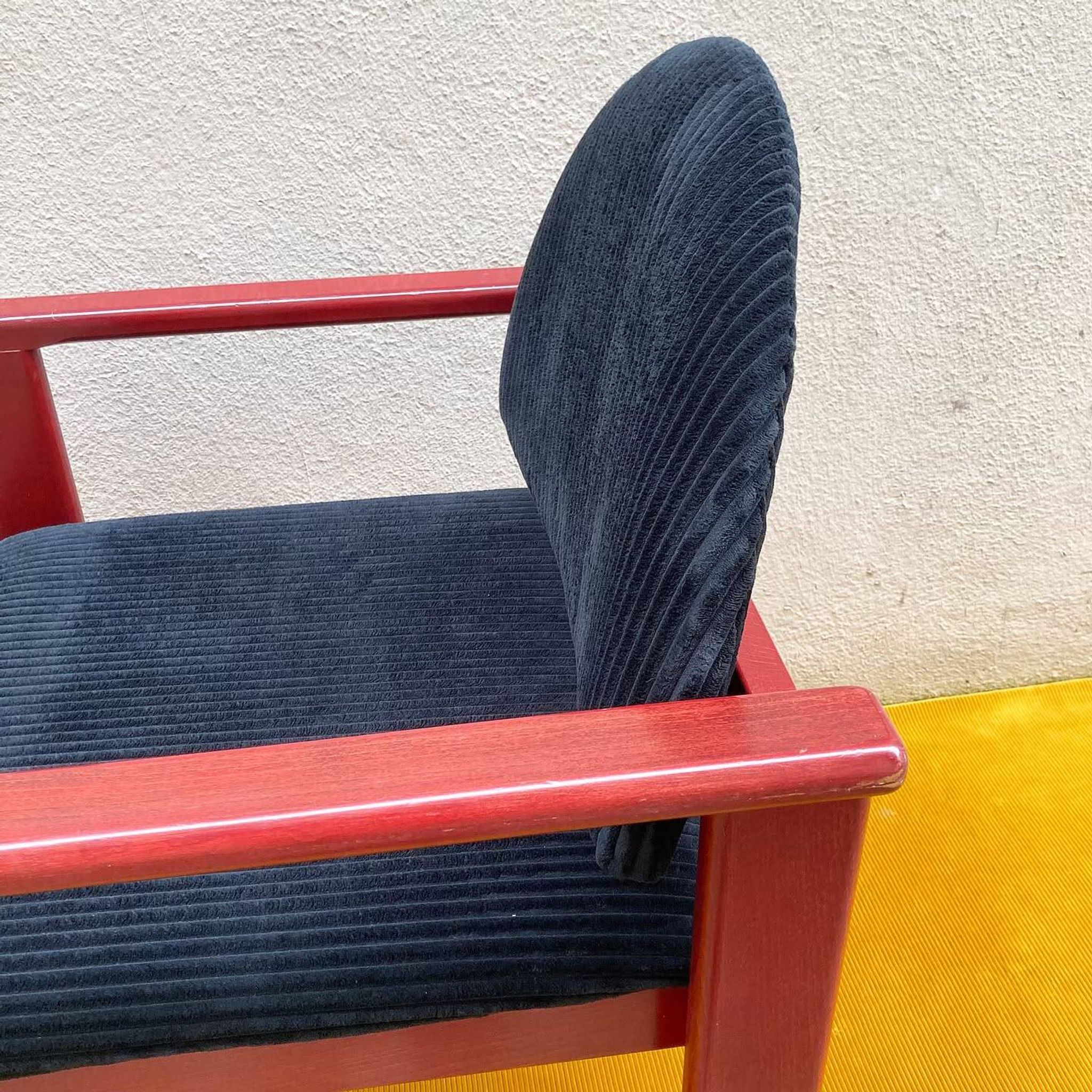 MMO Mobilier Collectif armchair, red patinated wood and black corduroy