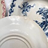 10 mismatched vintage soup plates in blue, green, and red ironstone