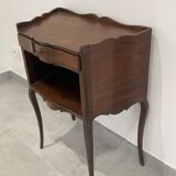 Stylized bedside table with curved shapes