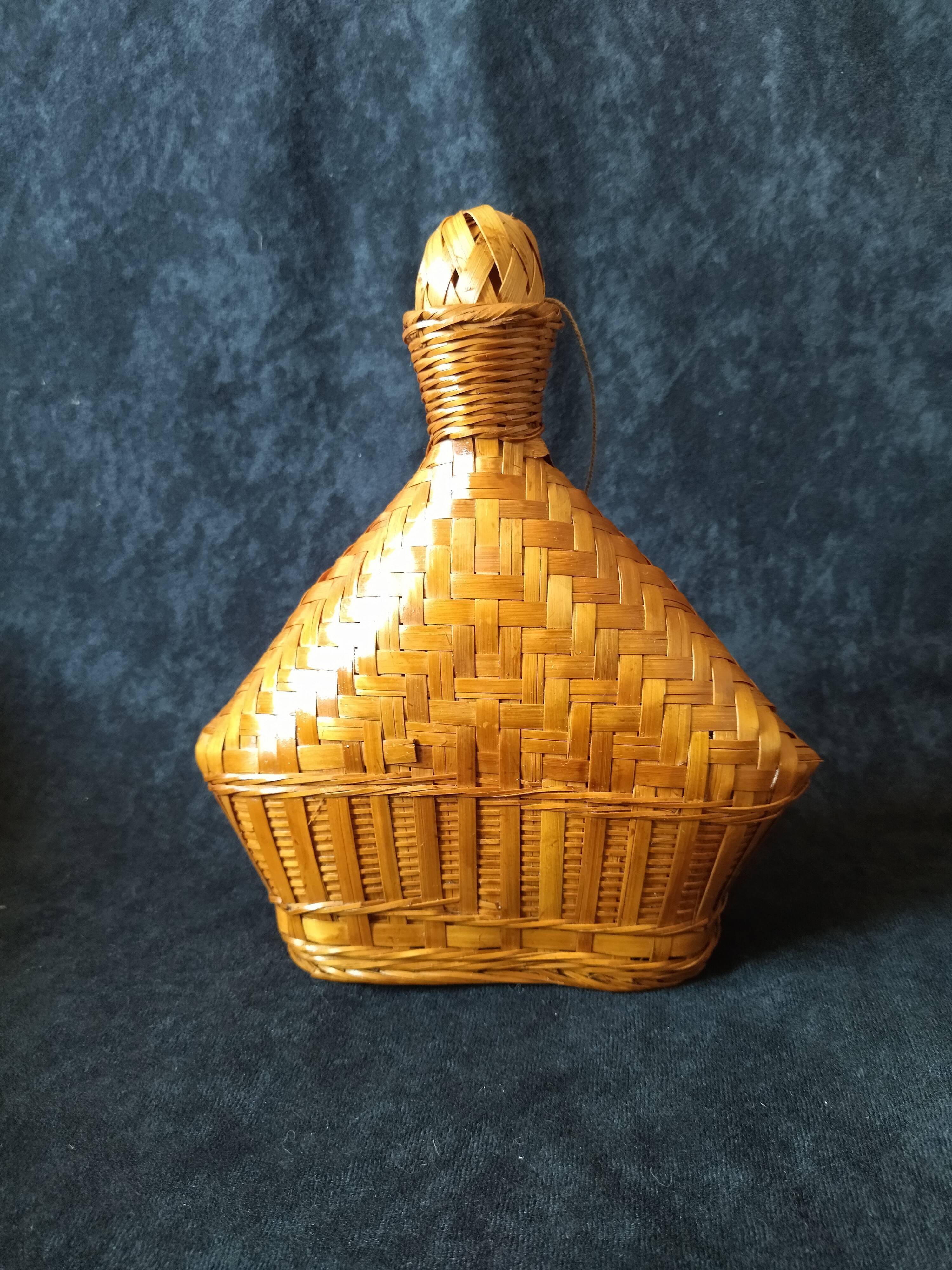 Vintage wicker and braided bamboo bottle