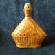 Vintage wicker and braided bamboo bottle