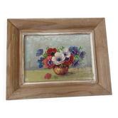 Painting bouquet of anemones in a vase.
