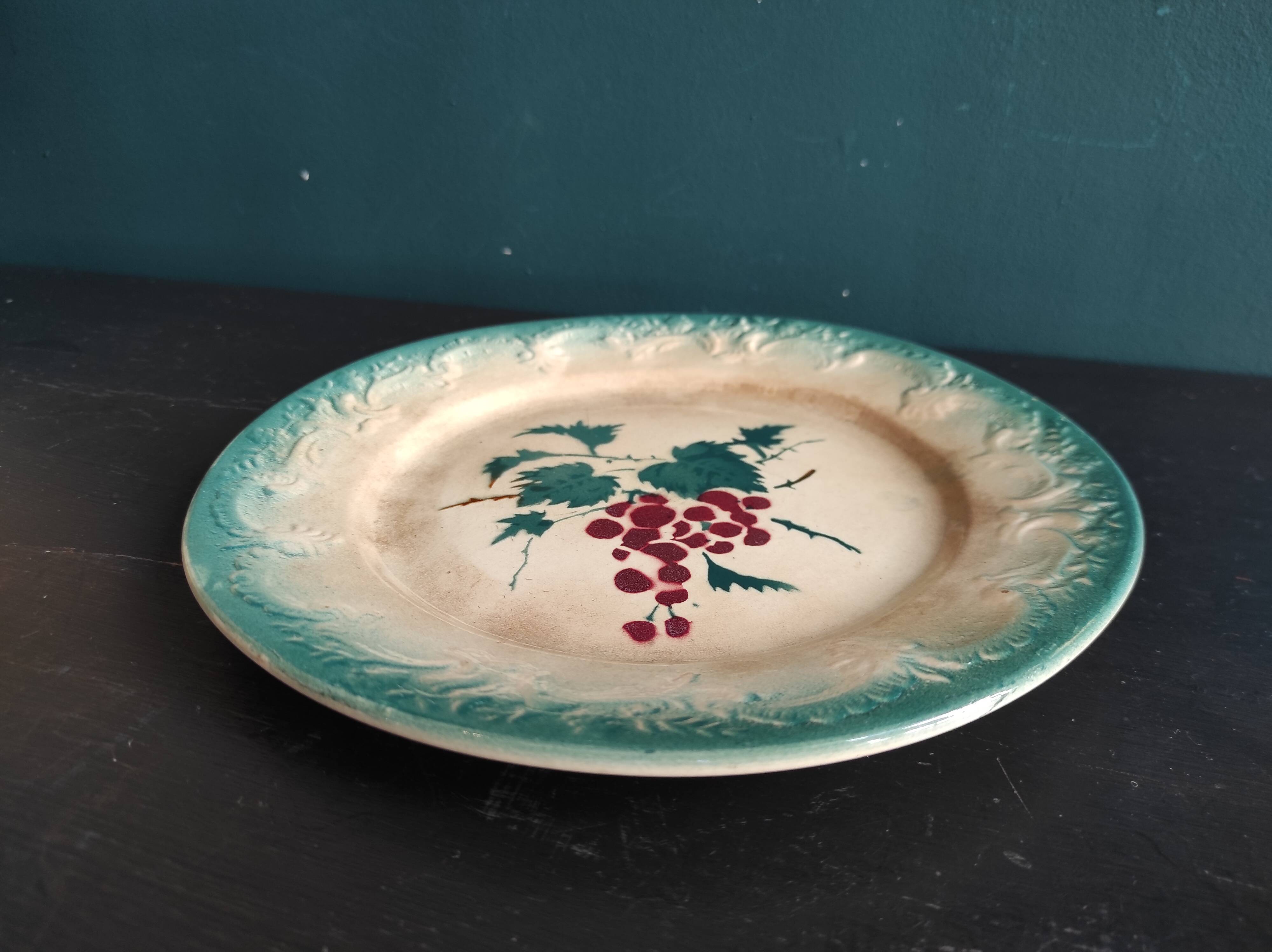 French antique barbotine plate decorated with stencil of grapes, faience de Castres