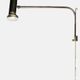 Minimalist metal wall light in the style of Jean Prouvé, circa 1950.