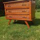 Rattan and wood splayed-leg chest of drawers