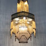 Art Nouveau style bronze chandelier with yellow and mauve pendants, 11 lights. 1960s