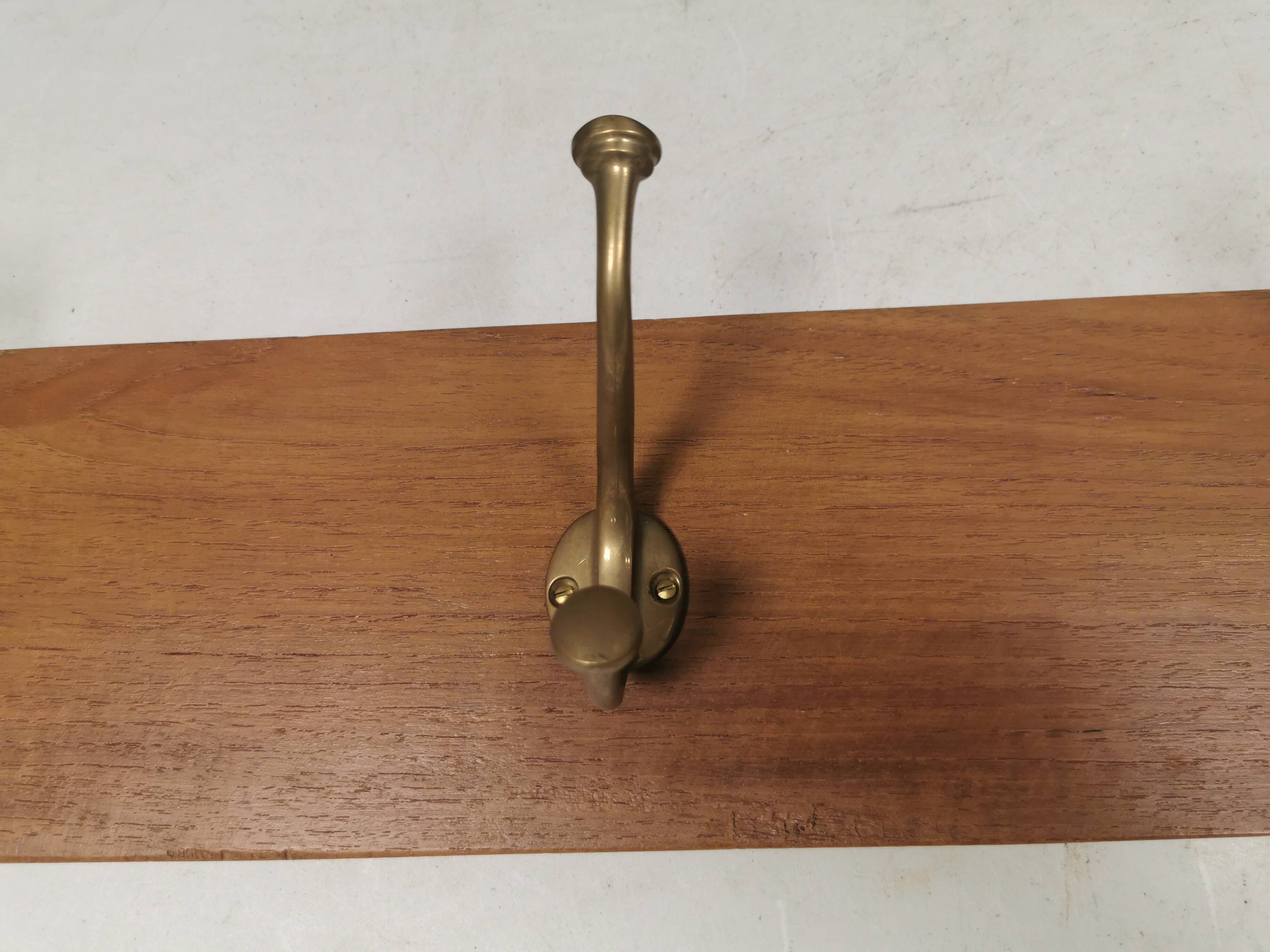 Coat rack in teak and brass. Denmark 1970-80s