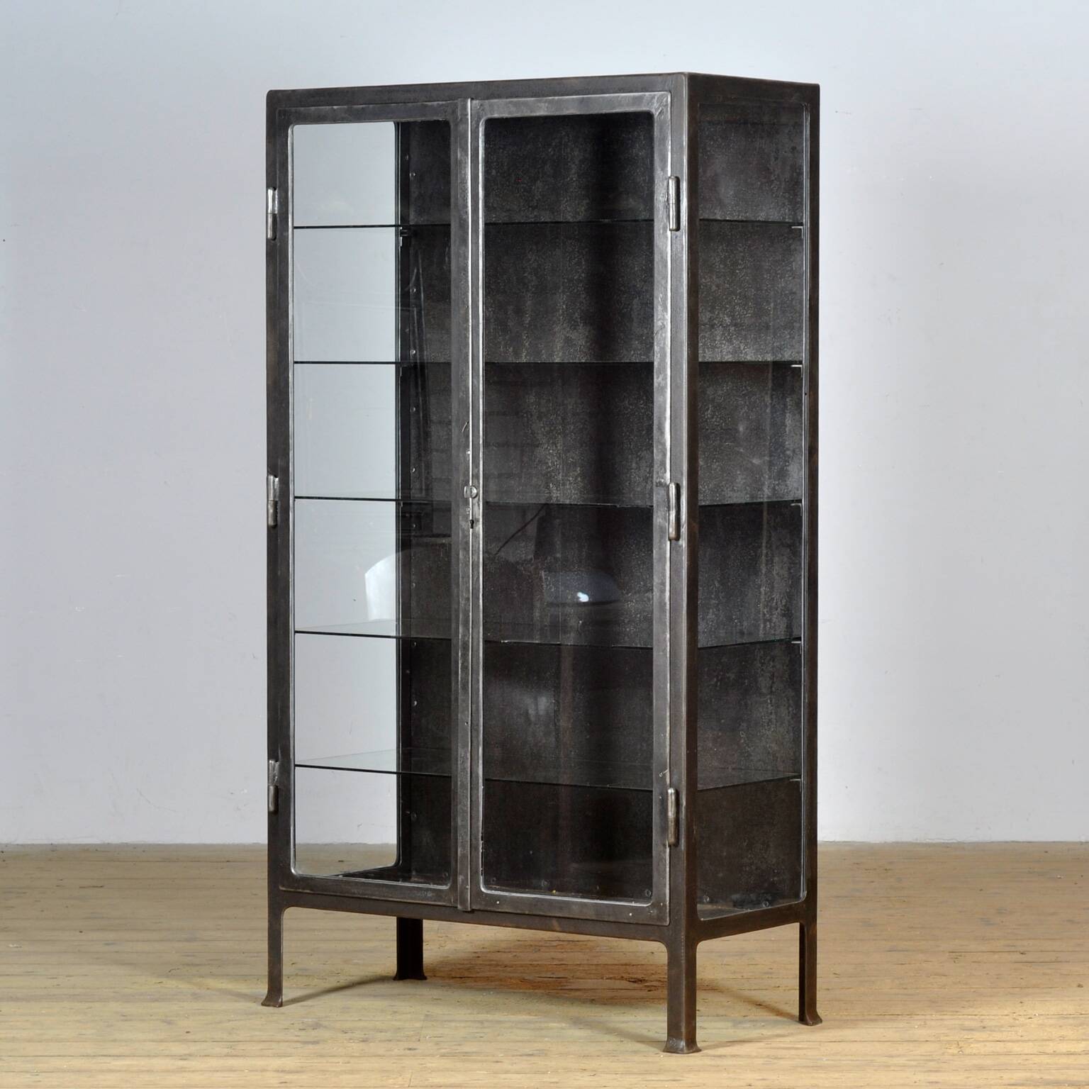 Polished iron medical cabinet, 1930s