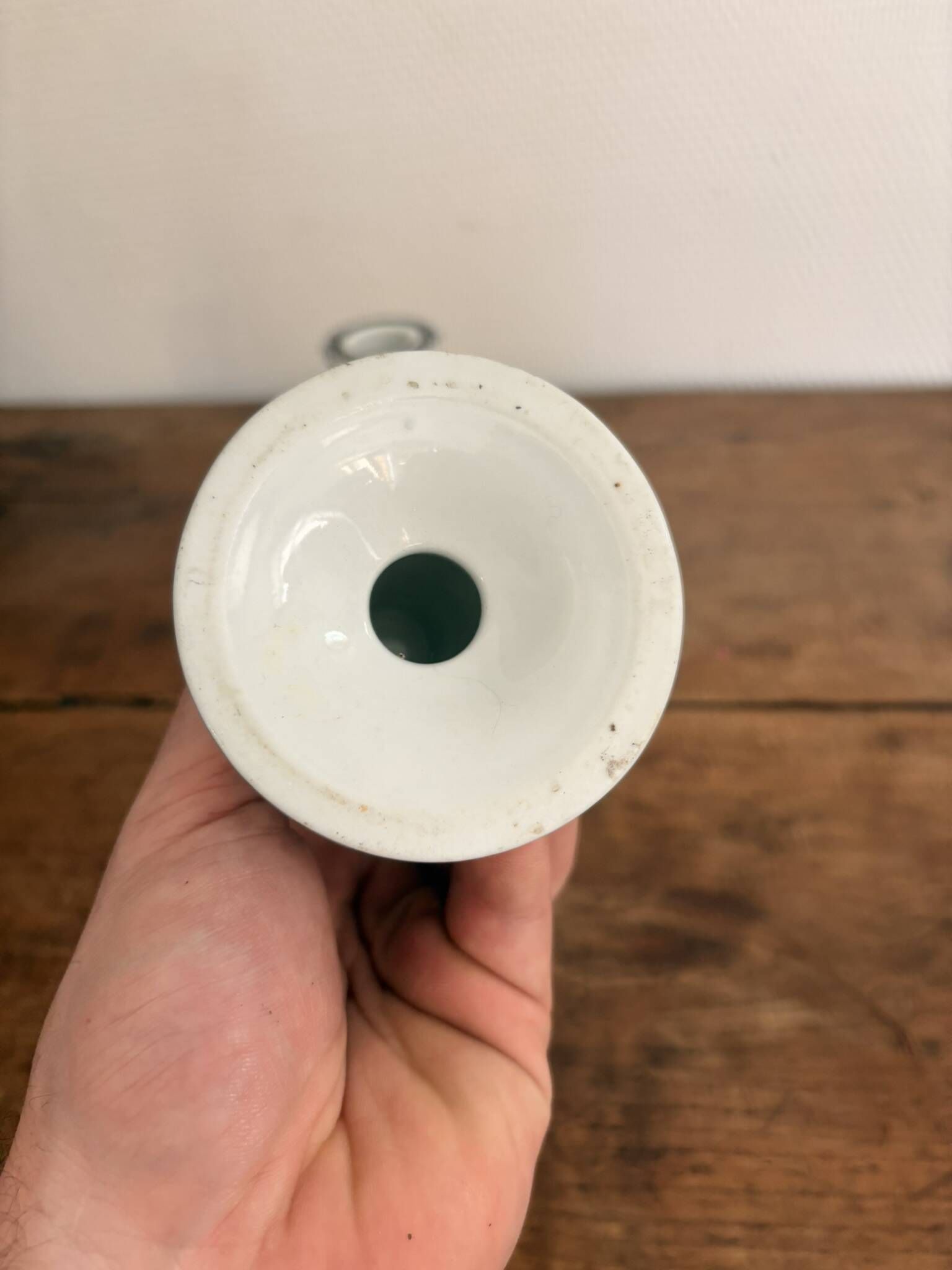 Pair of White and Black Porcelain Candle Holders with Berain Scroll Decoration, Baluster Style