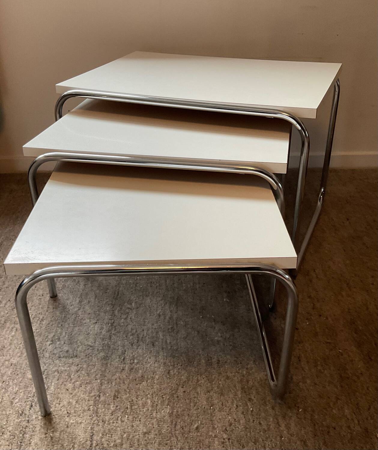 Trio of vintage nesting tables in Formica and chrome metal