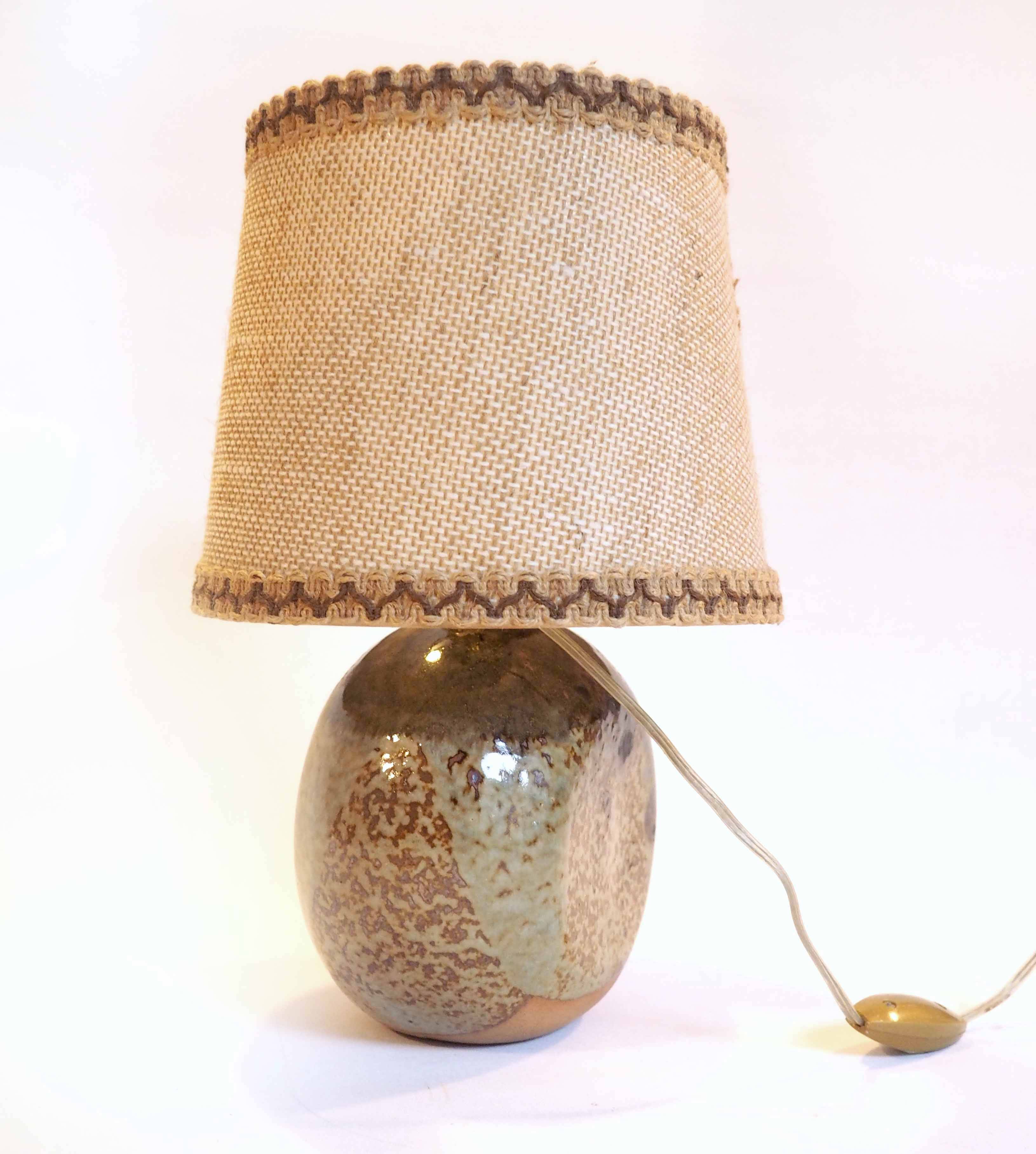 Flattened ball ceramic lamp