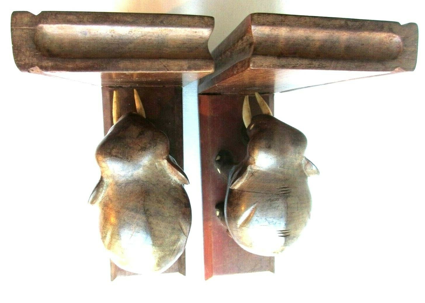 Art Deco bookends wooden elephants and bones on wooden terrace, book shape