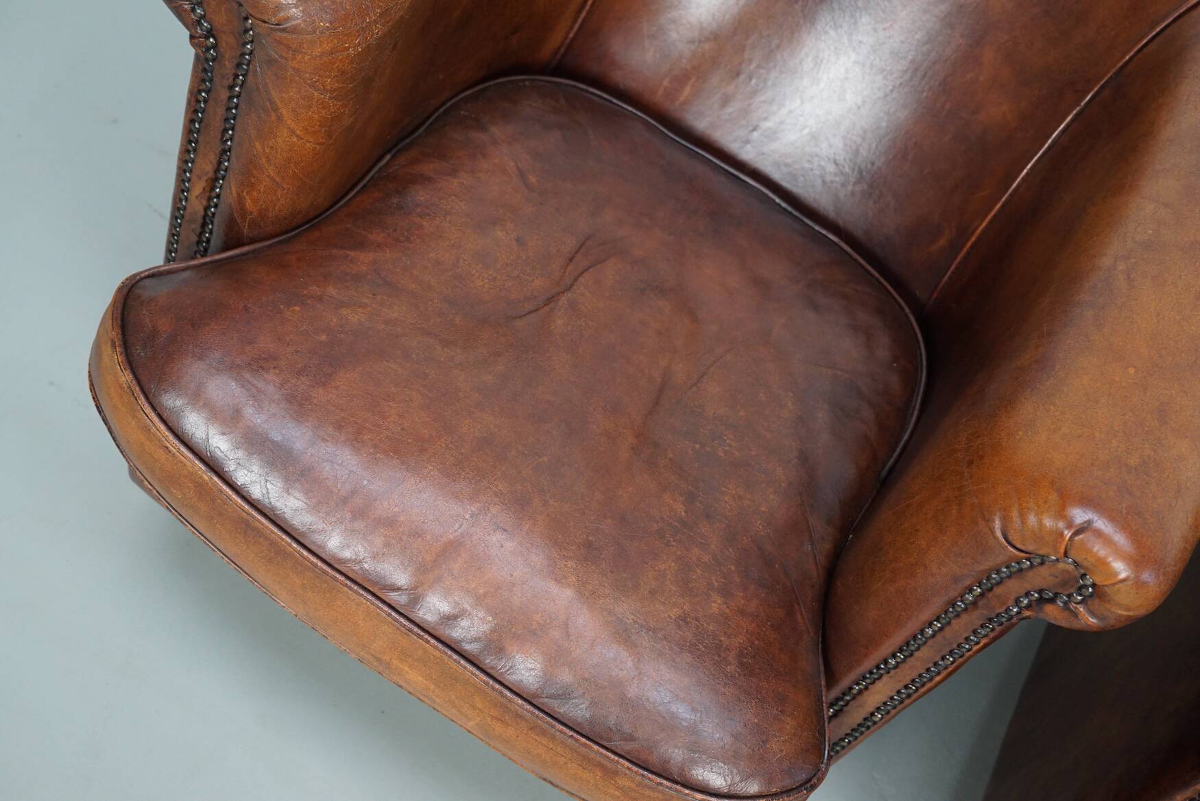 Vintage Dutch cognac coloured leather club chair, set of 2 with footstool