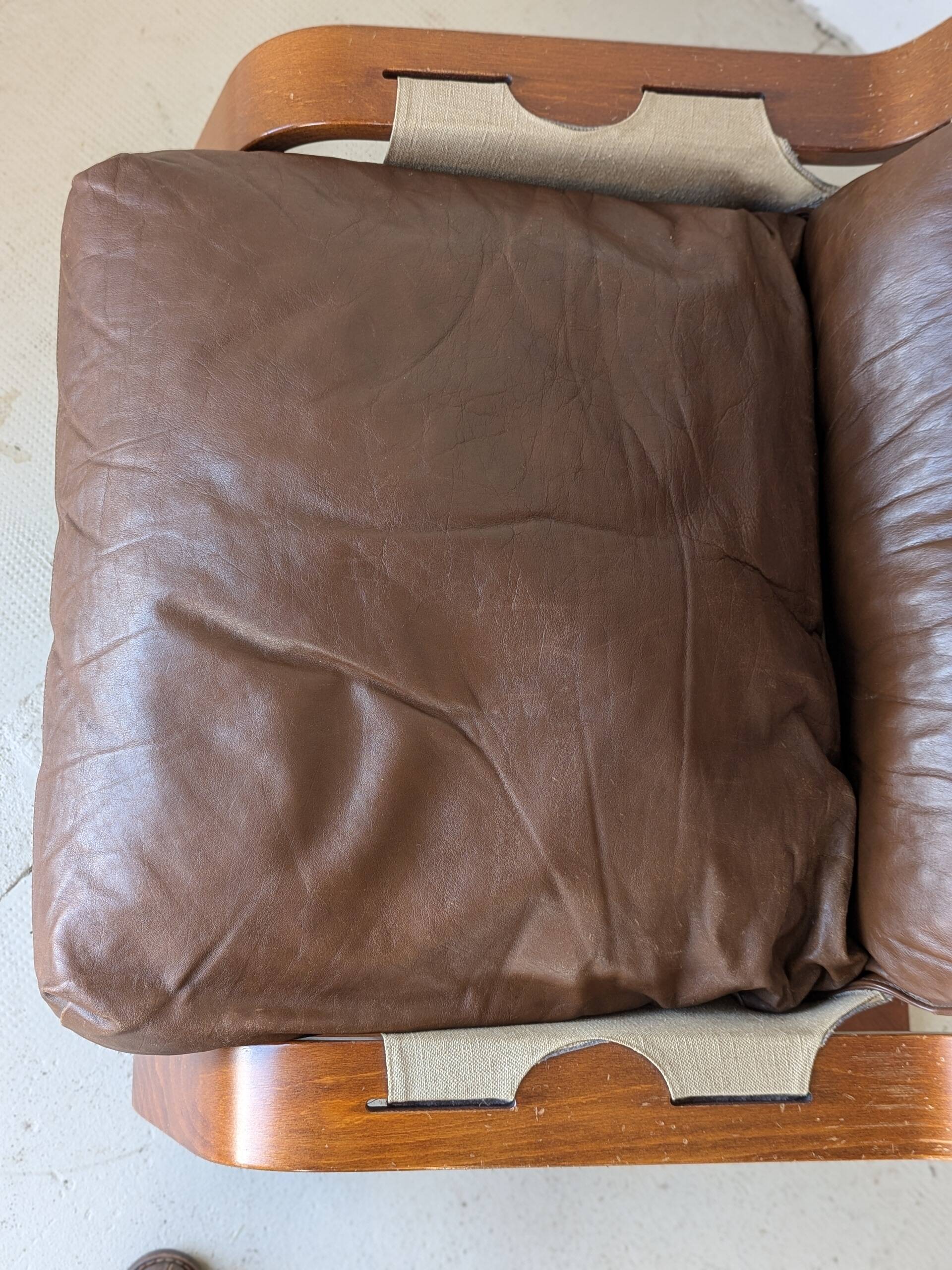 Leather and wood armchair, brutalist style.
