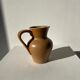 Pitcher in light beige sandstone