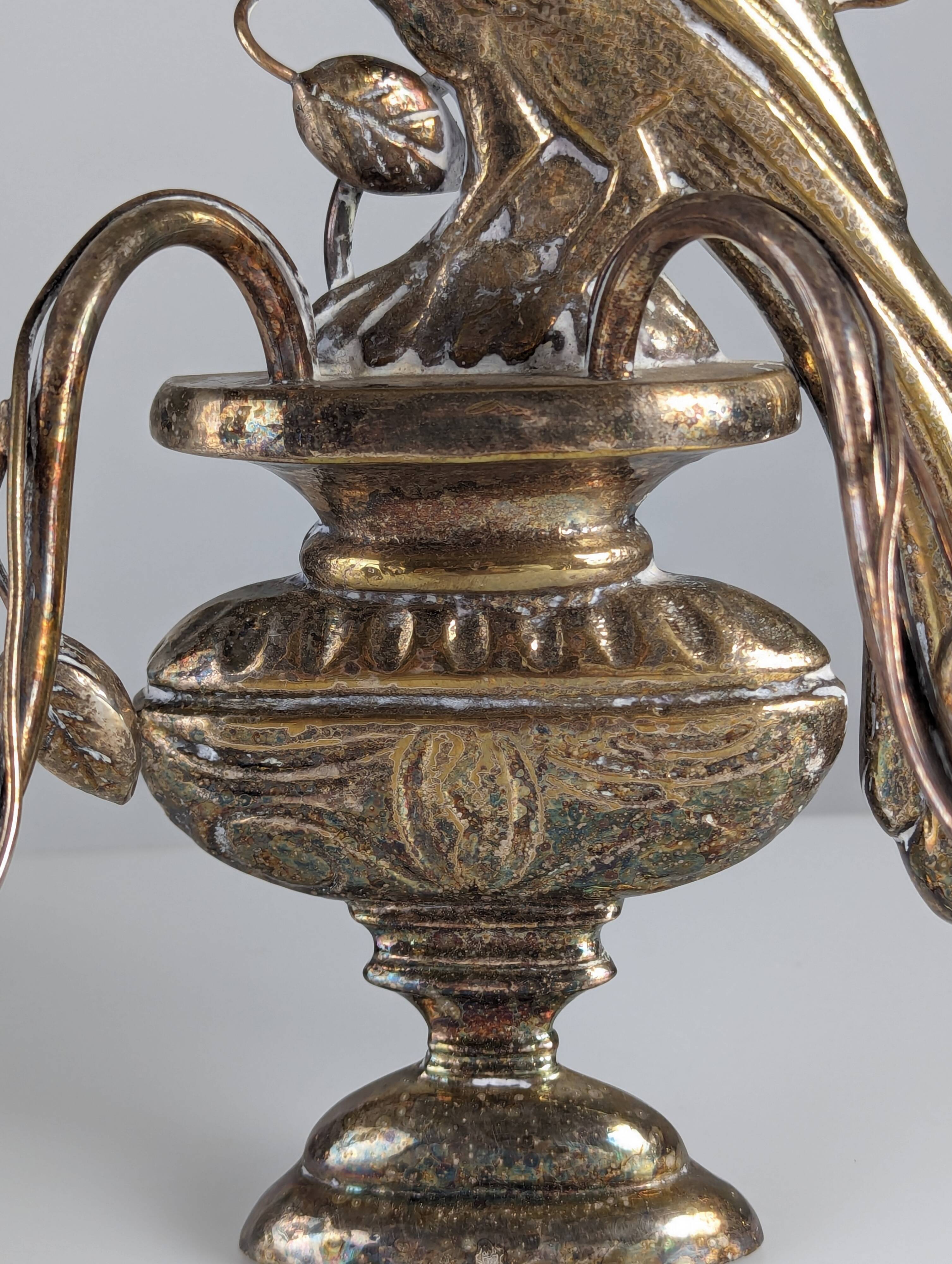 Pair of wall sconces with parrots and leaves