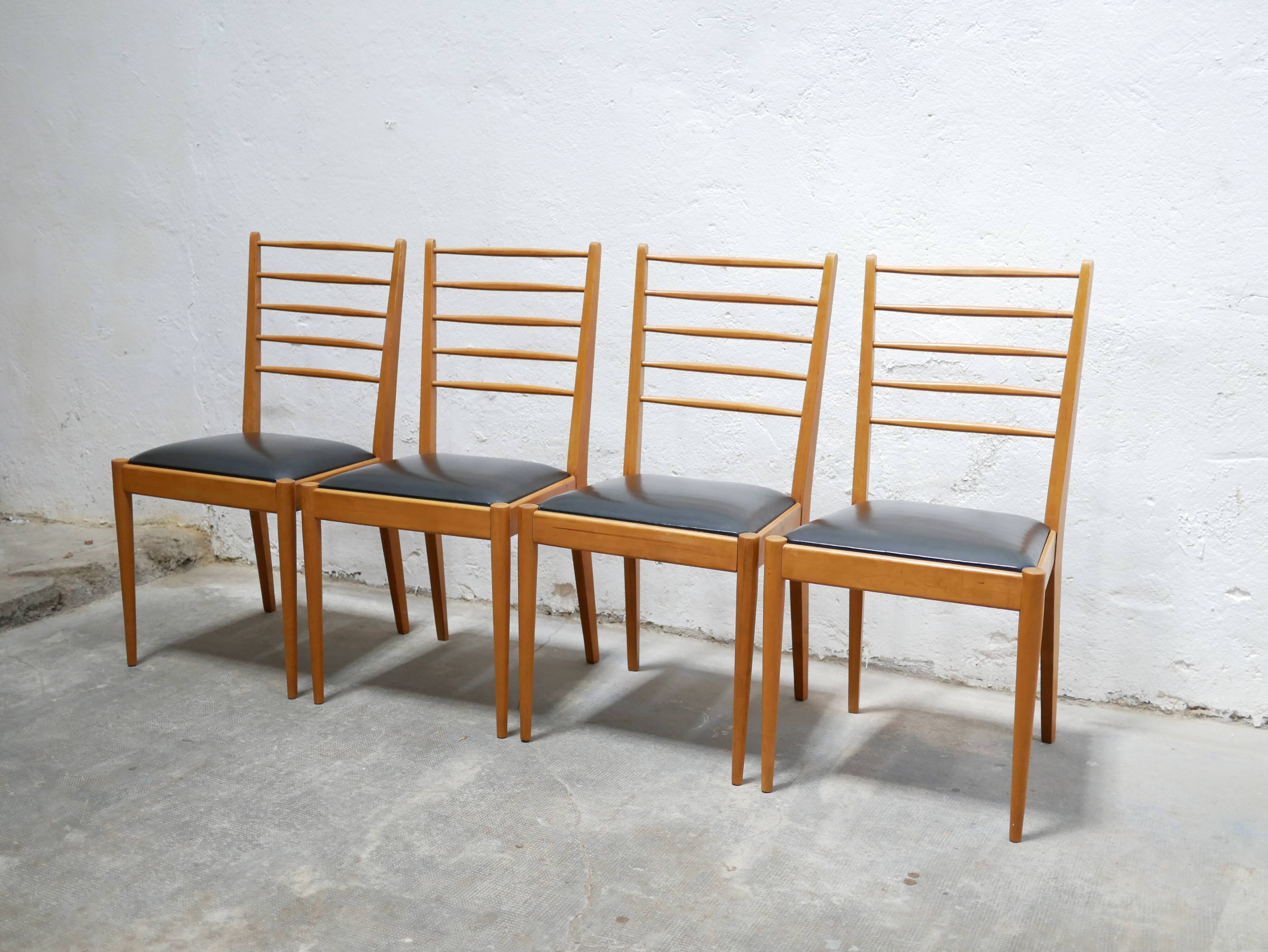 Series of 4 vintage chairs in wood and skaï