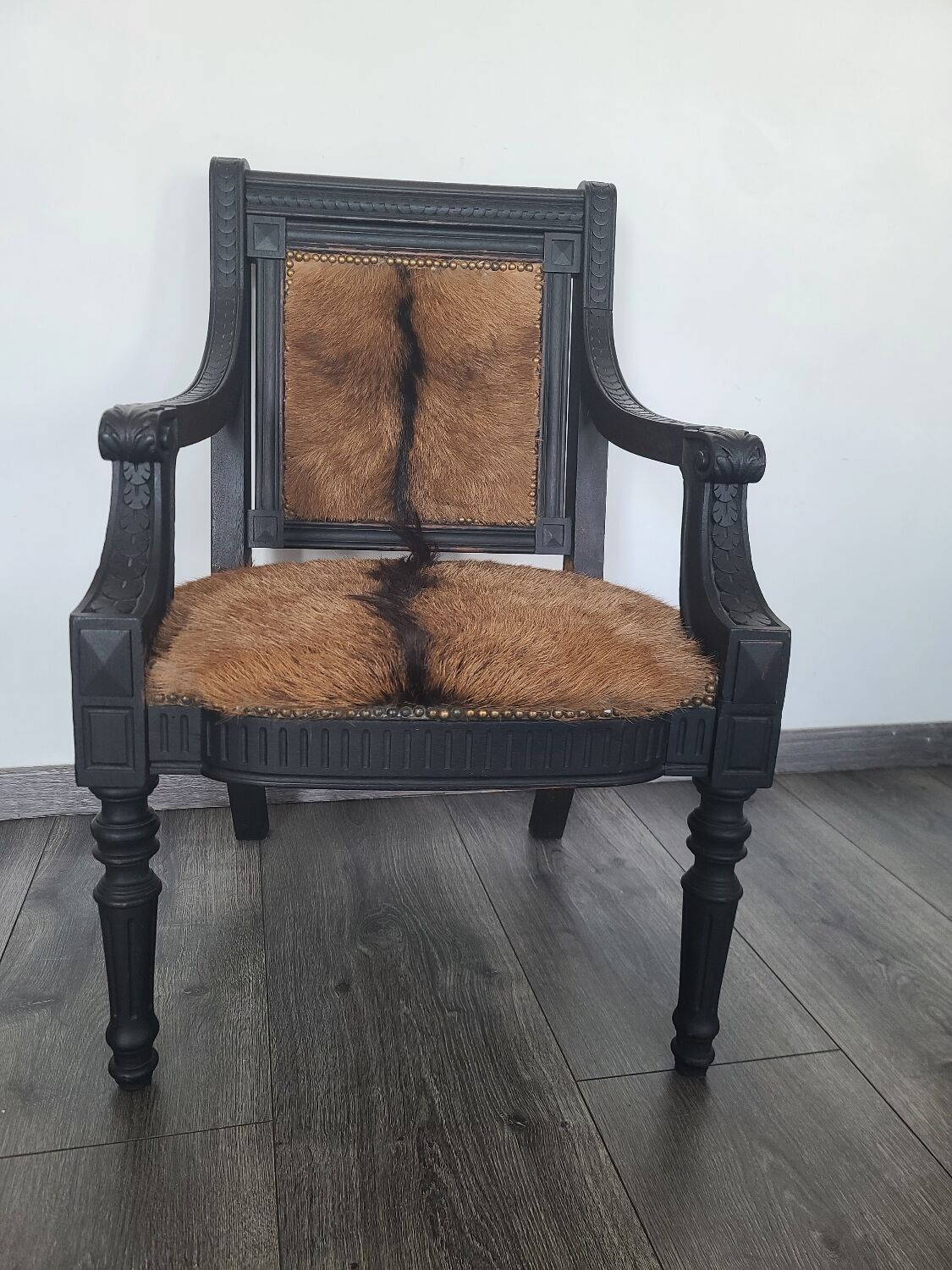 Character armchair in black wood and animal skin #CHMR