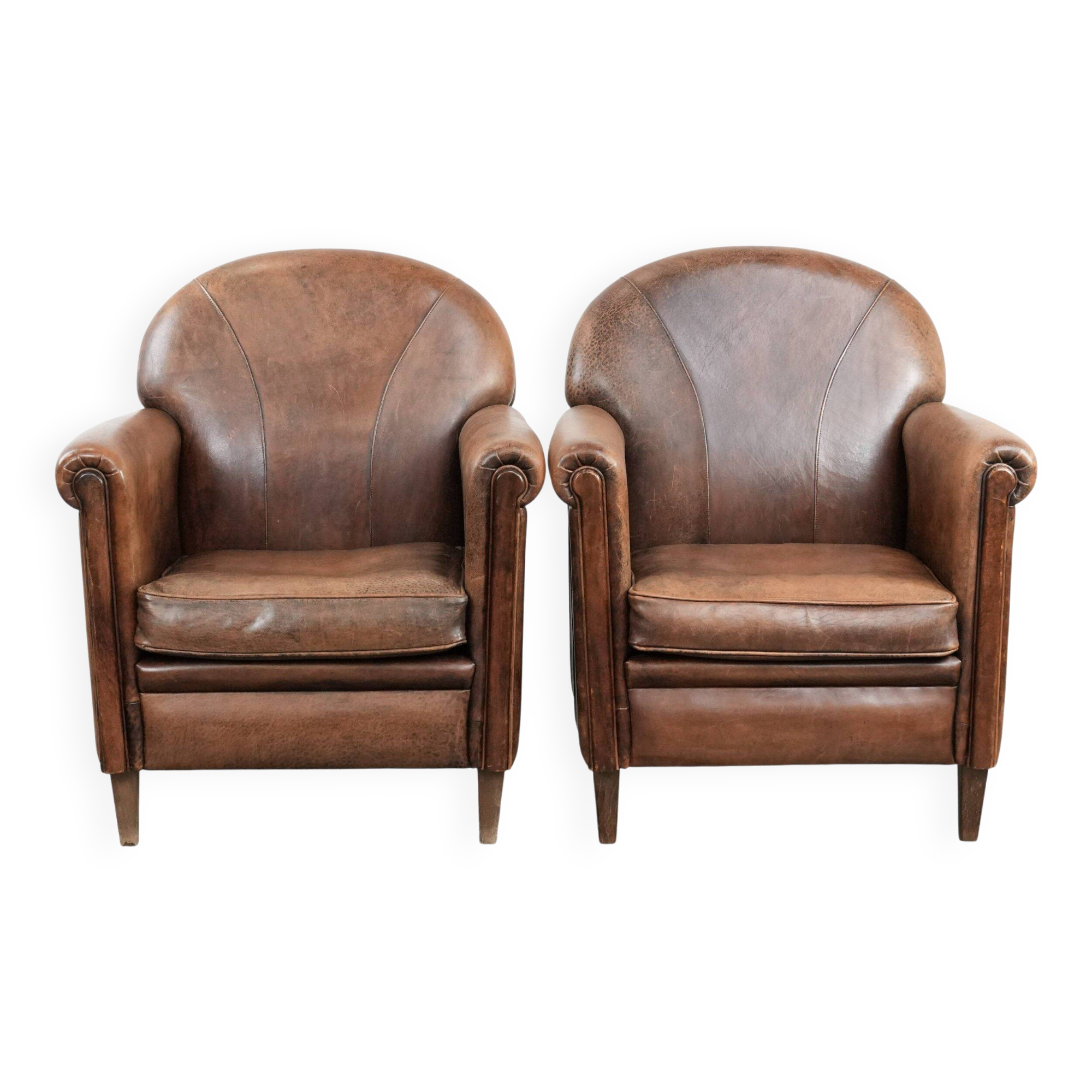 Set of 2 vintage sheepskin armchairs with a characterful appearance