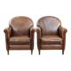 Set of 2 vintage sheepskin armchairs with a characterful appearance