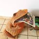 Vintage frog magazine rack in woven wicker design by Olivier Cajan