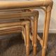 Trio of vintage pull-out tables in rattan and smoked glass 70s
