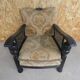 Old armchair upholstered in velvet, carved and caned wood