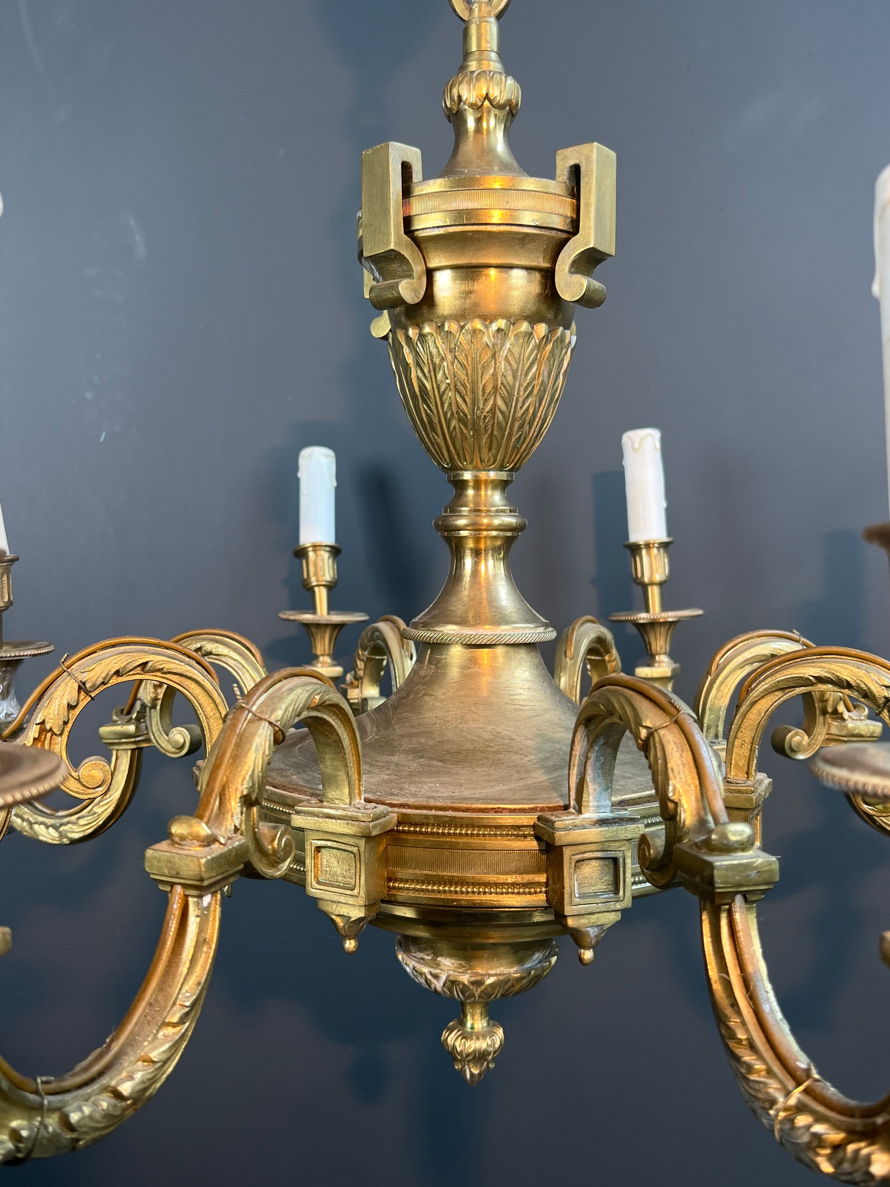 Important Louis XVI style chiseled bronze chandelier with 8 light arms by Lucien Gau