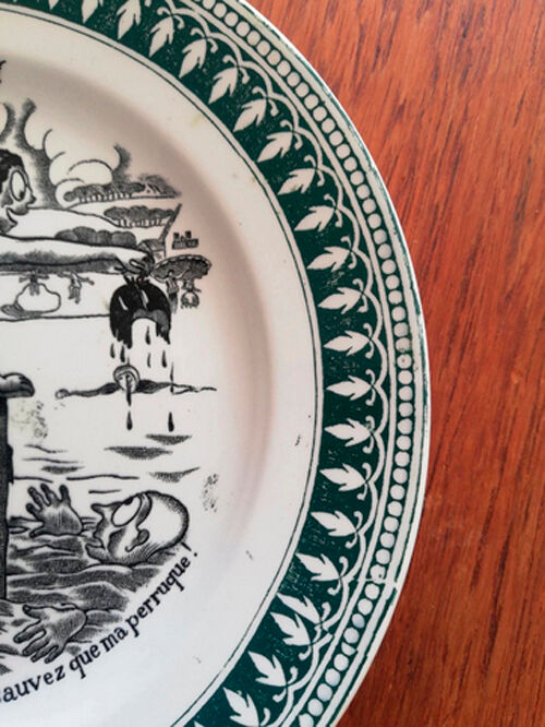 Old vintage dessert plate with drawing and phrase "swimming"