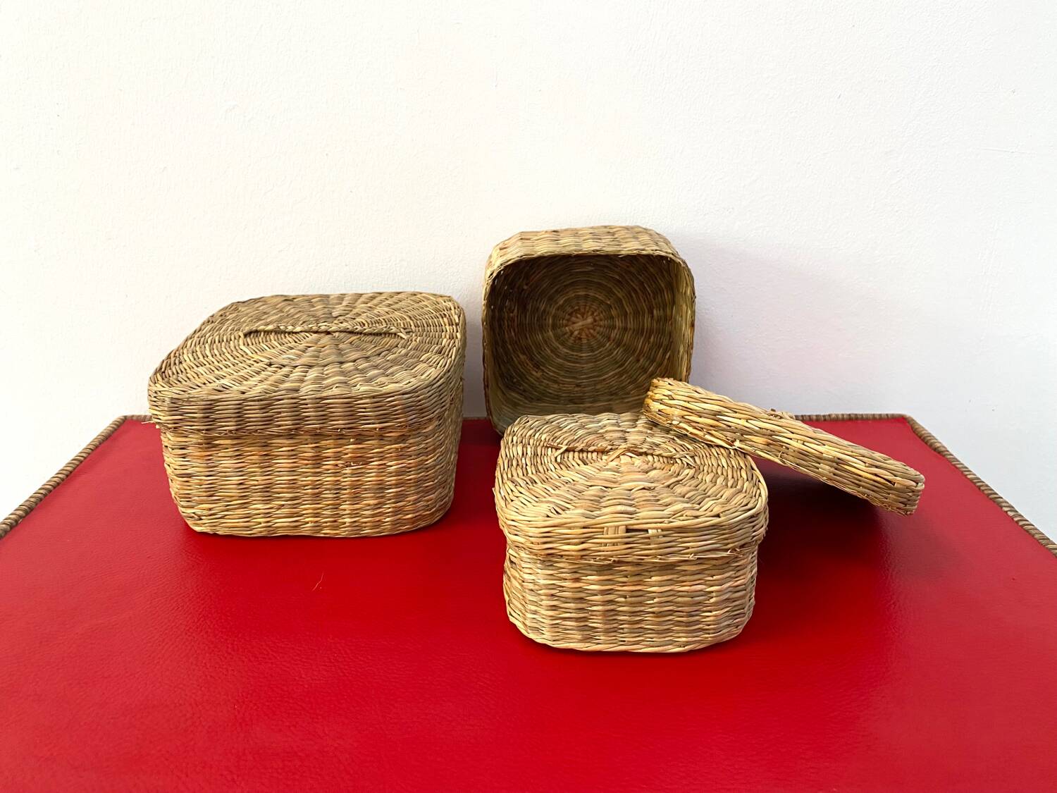 Vintage trio of small rattan nesting baskets