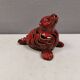 Beautiful seal in ceramic with metallic red glaze.