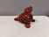 Beautiful seal in ceramic with metallic red glaze.