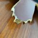 Vintage sun mirror in 60s/70s gold resin