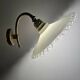 Wall sconces with scalloped opaline lampshades.
