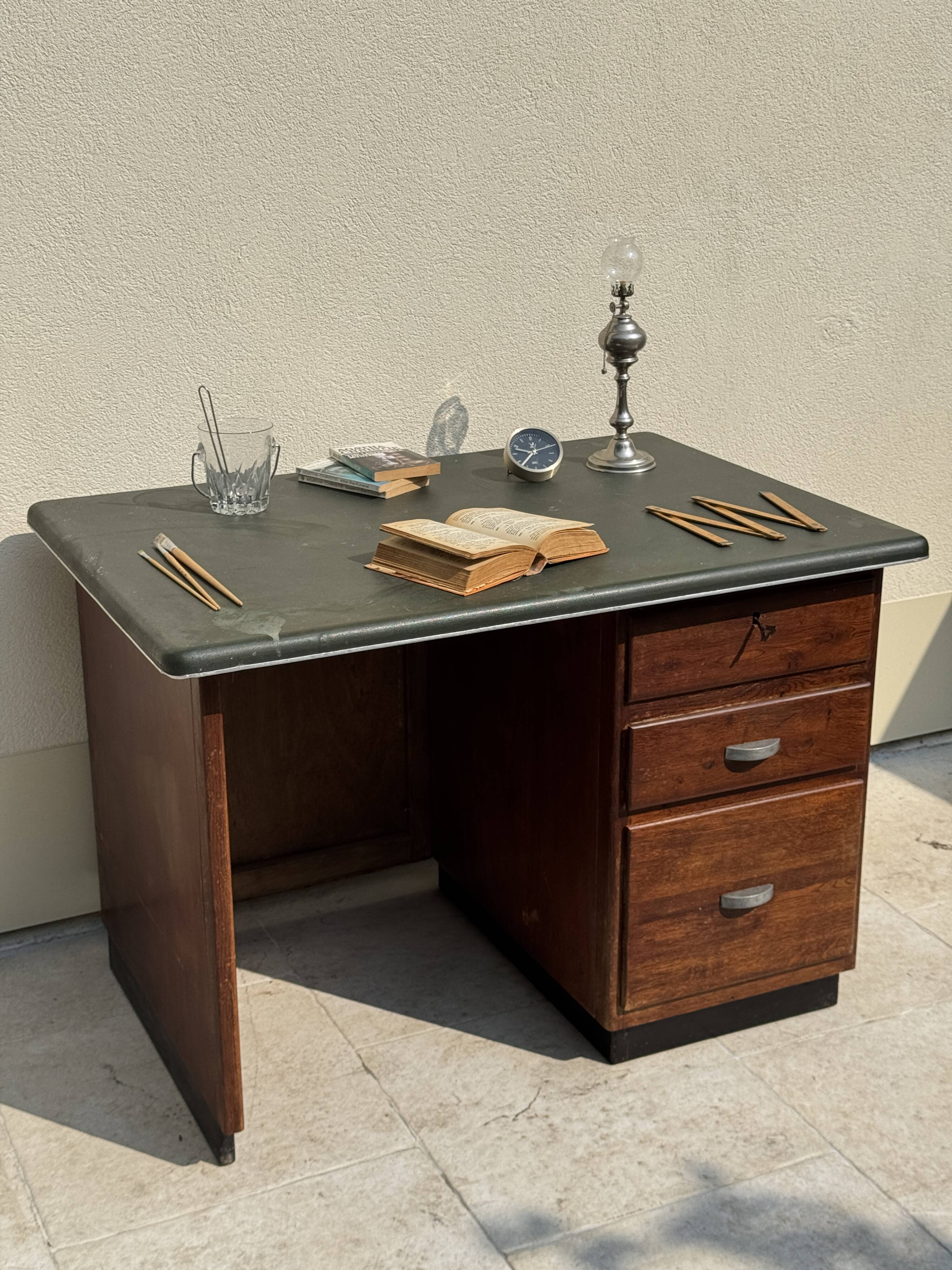 Modernist desk in wood and green moleskin upholstery