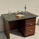 Modernist desk in wood and green moleskin upholstery