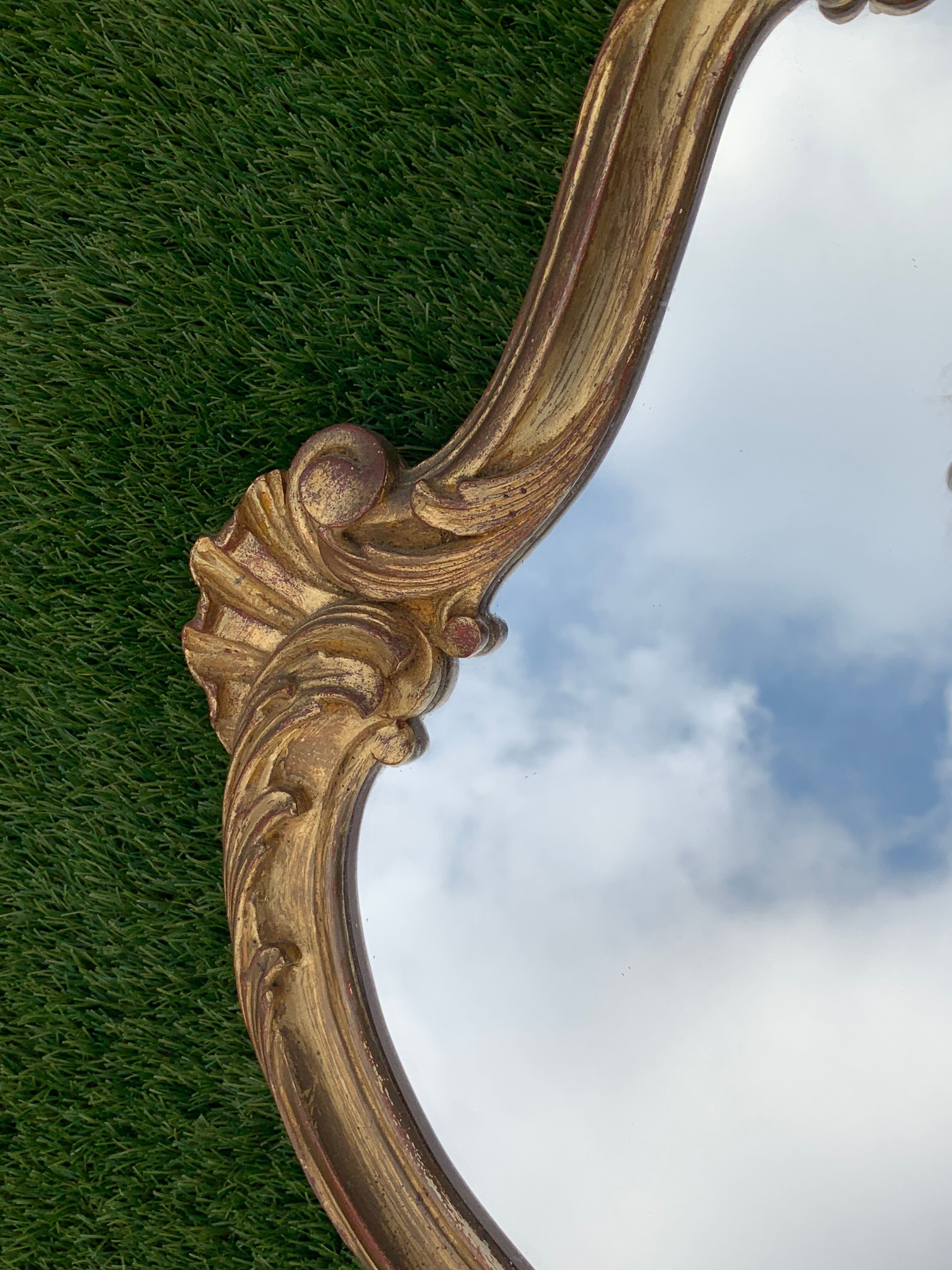 Old mirror in carved wood and gilded leaf, Louis XV rocaille style, twentieth century 59x87cm