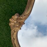 Old mirror in carved wood and gilded leaf, Louis XV rocaille style, twentieth century 59x87cm