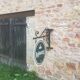 Double-sided "Loburg Beer" metal sign on wrought iron bracket