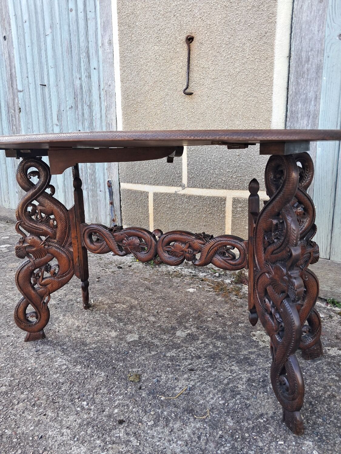 Asian table, mid-height, made of exotic wood.