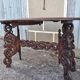 Asian table, mid-height, made of exotic wood.