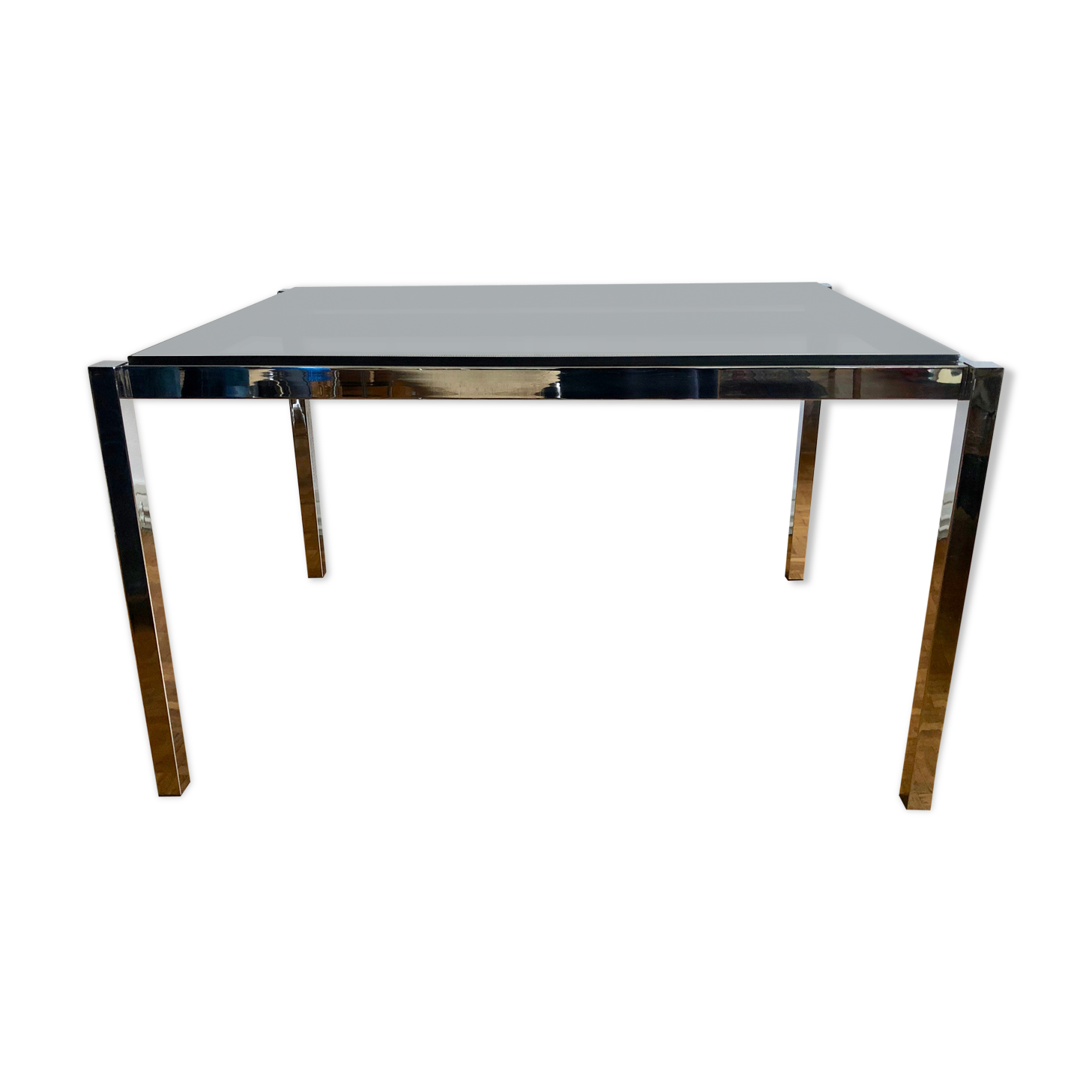 Glass and chrome metal dining table