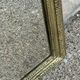 Louis Philippe mirror in gilded wood with an openwork frieze.