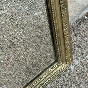 Miroir Louis Philippe en bois doré à frise ajourée