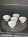 Set of 5 faceted white earthenware bowls with a naive decor, antique