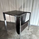 Vintage design magazine rack in chrome metal