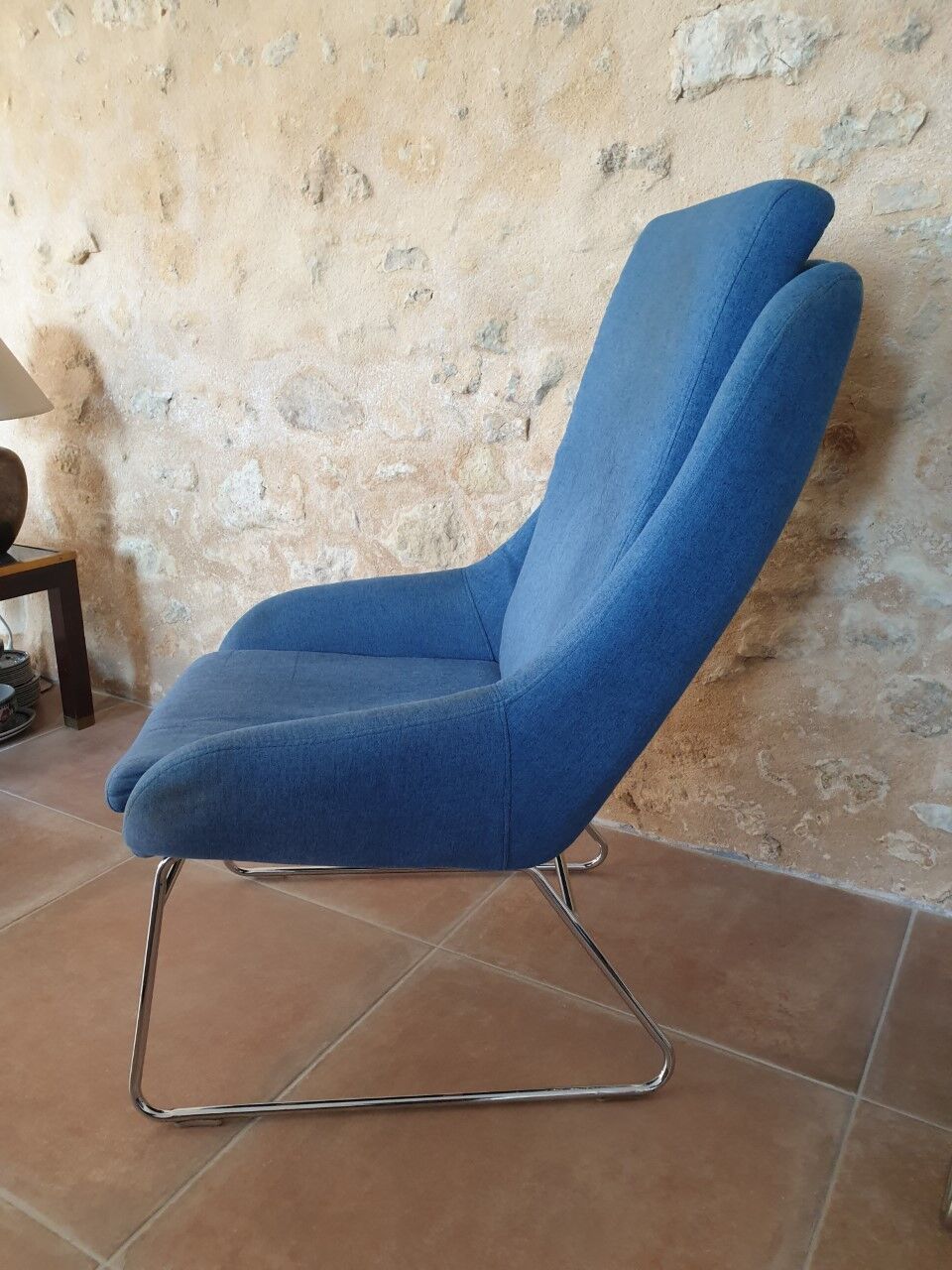 Armchair and its footrest