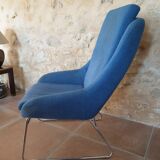 Armchair and its footrest