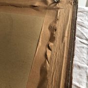 Old mirror with wooden frame and plaster moldings