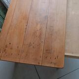 Coffee table with raw wood and a large drawer.